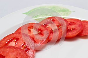 Juicy red tomatoes in table cloth . caro background photo