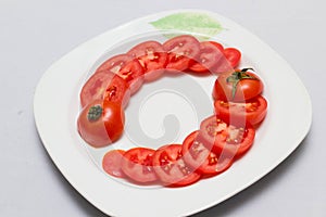 Juicy red tomatoes in table cloth . caro background photo