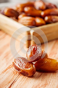 Juicy royal dates on a wooden rustic background