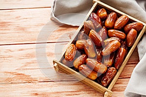 Juicy royal dates on a wooden rustic background