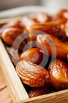 Juicy royal dates on a wooden rustic background