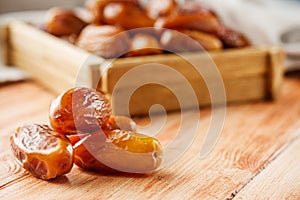 Juicy royal dates on a wooden rustic background