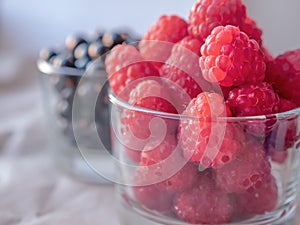 Juicy seasonal berries in the glassess. Summer fruits concept