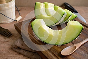 Juicy slice melon on a wooden table