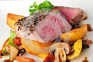 Juicy steak with baked potatoes and chilli