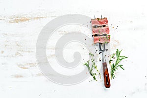 Juicy Steak on the fork with herbs and spices.