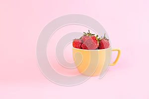 Juicy strawpberry in yellow cup
