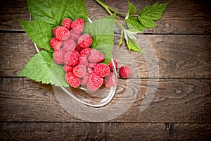 Juicy, succulent raspberry in bowl, healthy and strong antioxidant