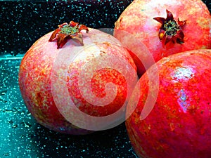 Juicy sweet ripe red summer autumn pomegranate fruit ondark background.  Punica granatum. photo