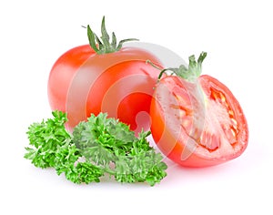 Juicy tomato cut in half and a sprig of parsley