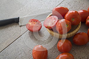 Juicy tomatoes on grey background