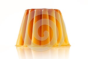 Juicy udding or creme caramel isolated over white background