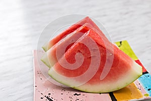 Juicy watermelon on a bright ceramic plate