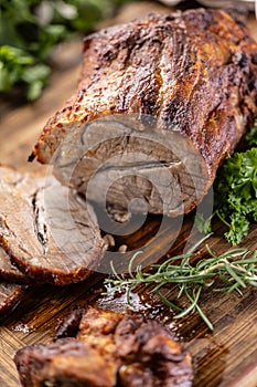 Juicy whole roasted neck on a cutting board