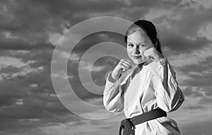 jujitsu girl in kimono on sky background