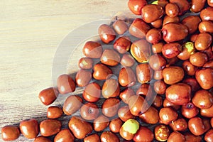 Jujube fruits  Ziziphus jujuba  on rustic background.  Copy space