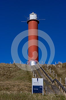Julianadorp, Noord-Holland, Netherlands. April 17, 2021. Stairs to the Zanddijk Groote Kaap, round red steel lighthouse