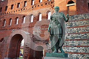 Julius Caesar bronze statue in front of Palatine Gate in Turin, Italy