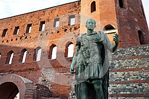 Julius Caesar bronze statue in front of Palatine Gate in Turin, Italy