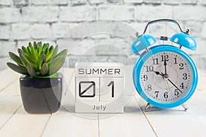 July 1 on the wooden calendar.The first day of the summer month, a calendar for the workplace. Summer
