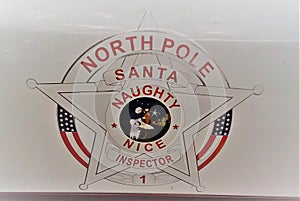 July 2018, Safety Harbor, Florida - a funny logo that reads North Pole Santa Naughty Nice Inspector