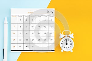 July 2024 Monthly calendar for 2024 year with pen on yellow and blue background