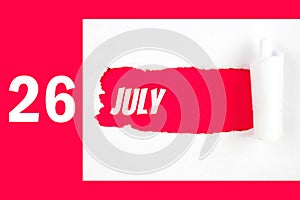 July 26th. Day 26 of month, Calendar date. Red Hole in the white paper with torn sides with calendar date. Summer month, day of