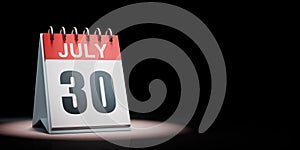 July 30 Calendar Spotlighted on Black Background