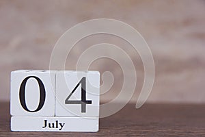 July 4 th. of American Independence Day with white block calendar on wooden table. copy space