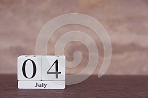 July 4 th. of American Independence Day with white block calendar on wooden table. copy space