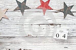 July 4th Calendar Blocks against Rustic Background with Stars