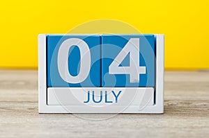 July 4th. Image of july 4 calendar on yellow background. Summer day. Empty space for text. Independence Day Of America