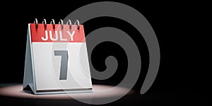 July 7 Calendar Spotlighted on Black Background