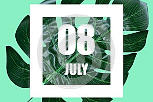 july 8th. Day 8 of month,Date text in white frame against tropical monstera leaf on green background summer month, day