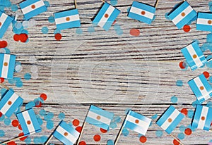 july 9. Independence day of Argentina, the concept of the Day of memory, freedom and patriotism. Mini flags with paper confetti on photo