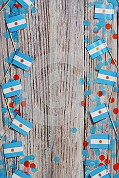 July 9. Independence day of Argentina, the concept of the Day of memory, freedom and patriotism. Mini flags with paper confetti on photo