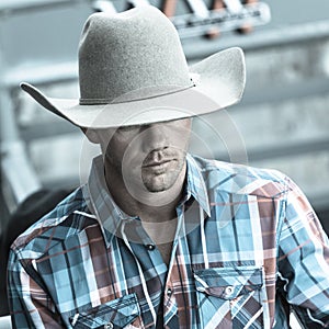 JULY 22, 2017 NORWOOD COLORADO - cowboy in plad shirt watches San Miguel Basin Rodeo, San Miguel. Sport, Norwood