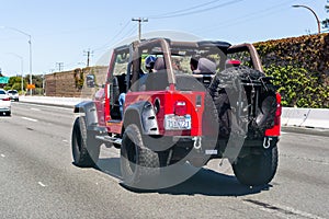 July 14, 2019 Redwood City / CA / USA - Jeep Wrangler Unlimited driving on the freeway in San Francisco bay area; the two doors