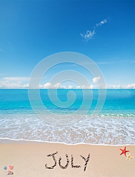 July on a tropical beach under clouds