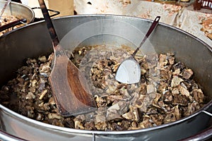 Jumari, delicious unhealthy fried pork greaves in a basket for sale during street food festival