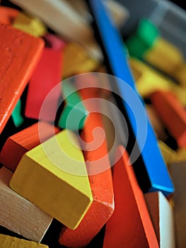 Children`s Wooden Building Blocks Brightly Colored in Toy Box