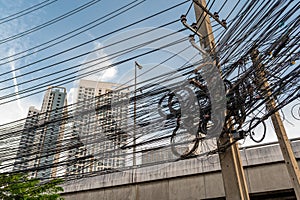 Jumble of overhead electricity and communication cables