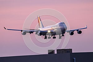 Jumbo Jet landing in low light after sunset