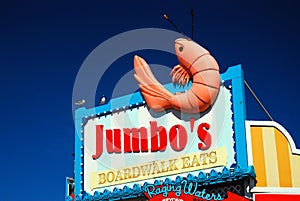 A jumbo shrimp hangs from a dinerÃ¢â¬â¢s sign