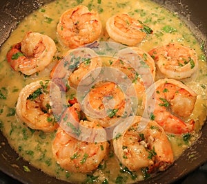 Jumbo shrimp scampi cooking in a pan