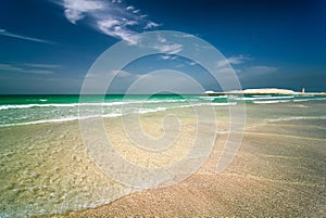 Jumeirah beach in Dubai with crystal clear sea water and amazing blue sky, Dubai, United Arab Emirates.