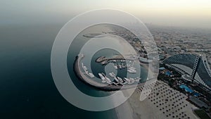 Jumeirah Beach near Burj Al Arab hotel in Dubai, UAE. Helicopter view