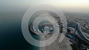 Jumeirah Beach near Burj Al Arab hotel in Dubai, UAE. Helicopter view