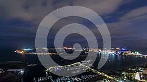 Jumeirah Palm Island night to day timelapse dubai shot from the rooftop top of the tower in dubai marina, uae
