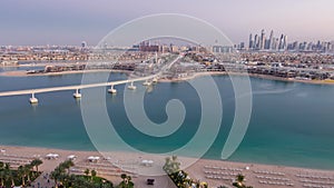 Jumeirah Palm island skyline day to night timelapse in Dubai, UAE.